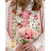 The model wears the coverall and holds a bouquet of coordinating pink roses.