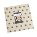 A square bundle of precut tan fabrics with a Moda Fabrics Bloom & Grow label in the center