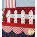 A super close up on the picket fence, , demonstrating details on the scalloped border, fabric, piecing, and top quilting.
