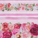 Up close of border stipe fabric featuring pink stripes and roses