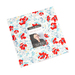 A bundle of white, red, and blue floral fabric squares with a Moda Fabrics Time and Again label in the center