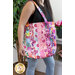 A shot of a model carrying the jelly roll tote, demonstrating the patchwork and size.