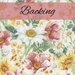 A swatch of cream fabric packed with daisies and wildflowers in pink, green, yellow, and white. A pink banner at the top reads 