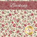 A cream fabric featuring red classical florals throughout and a red 