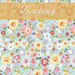 Swatch of light blue fabric with tossed stylized wildflowers. An ochre banner at the top reads 
