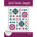 front of Secret Garden Sampler quilt pattern showing the completed project