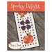 Front of Spooky Delight pattern featuring finished project displayed on a wooden table.