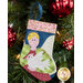 The completed Angel stocking, hung on a green Christmas tree decorated with red bulbs.