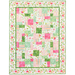 Photo of a finished pink, white, and green floral quilt isolated on a white background.