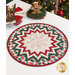 The completed topper in green, cream, and red Christmas fabrics, staged on a white table with coordinating decor.