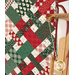 A close up on the right side of the picnic quilt, showing fabric and stitching details. A blurry sled can be seen in the foreground.