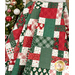 The picnic quilt, artfully draped over a ladder to show dimension and form. The quilt is surrounded by coordinating Christmas decor.