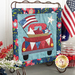 The completed mini quilt at a slight angle, staged with coordinating flowers and patriotic decor.