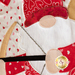 A super close up on the applique cupid gnome, showing fabric and topstitching details.