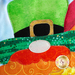 A super close up on the applique leprechaun gnome, showing fabric and topstitching details.