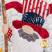 A super close up on the applique patriotic gnome, showing fabric and topstitching details.