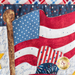 A super close up on the applique American flag, showing fabric and topstitching details.