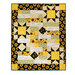 The completed Comfort of Psalms Quilt, colored in bold yellow, black, white, and green fabrics from the Sunflower Splendor collection, isolated on a white background.