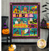 The completed Spooktacular Night Out quilt in cheerful Halloween colors, isolated on a white background.