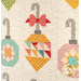 A super close up on a three patchwork ornaments, demonstrating fabrics, piecing, and top quilting details.