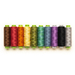 A row of coordinating thread spools, arranged in rainbow order and isolated on a white background.