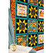 A side view of the Gather Together quilt in warm orange and teal colors with a blue knit blanket thrown over a chair with an open book sitting on top.