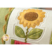 A super close up on the center applique sunflower of the pillow, demonstrating fabric and stitching details.