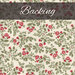 A cream fabric with green leaves and red roses with a dark banner at the top saying 