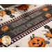 A super close up on the fabric with stylized text that reads Trick or Treat.