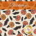 A swatch of cream fabric with tossed pumpkins wearing witch hats, bats, and sparkles. A bright orange banner reads 