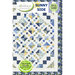 The front of the Sunny Side quilt pattern showing a geometric quilt with an array of diamond blocks