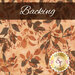 A swatch of orange batik fabric with tonal golden tan and brown mottled leaves. A brown banner at the top reads 