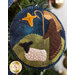 A super close up on the shepherd wool ornament, demonstrating fabric, applique, and stitching details.