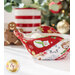 A close up of a Bowl Cozy, colored in red and white baking themed fabrics from the Sugar Coated collection and staged with coordinating decor.