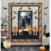 A Halloween-themed quilt featuring black cats, pumpkins, and bats, displayed in a cozy room.