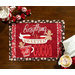 A top-down image of the Everything Is Sweeter With Cocoa panel placemat on a wooden table, with fabric napkins, peppermint candy, and a mug of hot cocoa peeking into the corners of the frame.