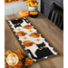 The completed Scaredy Cat Table Runner, staged on a rustic wood table with coordinating napkins, plates, and decor.