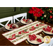 The completed Venice Table Runner, staged on a dark wood table surrounded by coordinating tableware, napkins, and a decorated Christmas tree.