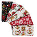 A collection of festive fabric pieces featuring holiday motifs like poinsettias, animals, and snowflakes.