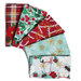 A collection of red, green, and white holiday fabrics, featuring various festive designs.