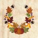 Colorful autumn-themed wreath with leaves, candies, spiders, and a pumpkin on a textured background.