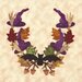 A decorative wreath featuring purple witches' hats, colorful leaves, and a black bat at the center.