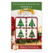 Front cover of the pattern showing the completed project in red, green, and white fabrics, staged on a craft stand atop a rustic wood table top with coordinating holiday decor.