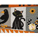 A close up on the crow and black cat blocks, showing fabric and top quilting details.