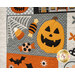 A super close up on the block with a smiling jack o'lantern, cobweb, and tossed pieces of candy, showing applique, top stitching, and top quilting details.