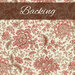 A cream swatch of fabric with an ornate pattern of pink and brown Jacobean flowers. A brown banner at the top reads 