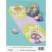 Image of the Happy Easter Table runner featuring two bunnies holding bright easter eggs on a green oval background, with the Easter Stuffed Eggs project adjacent to the runner. 