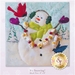 A happy snowman with cardinal and popcorn garland celebrating a snowfall.