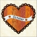 October block embroidered with pumpkins on orange patchwork heart.