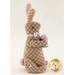 Bitty Bunny Pincushion Pattern cover featuring the finished stuffed bunny pincushion.
